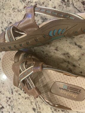Women’s Skechers Outdoor Lifestyle Metallic Brown Sandals with Turquoise Stitch